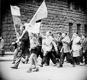 Demonstrators with a banner "We demand bread" at the Castle Square